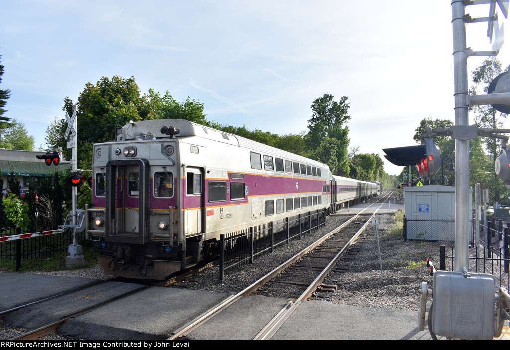MBTA Train # 498 arriving into the station with Cab Car # 1701 in the lead 